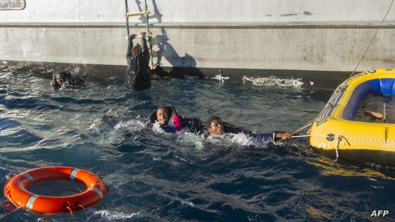Would-be immigrants grab the ropes of an inflatable boat before being rescued by Spanish emergency services and the Moroccan navy in the Strait of Gibraltar, on December 3, 2012. Spanish emergency services and the Moroccan navy intercepted three inflatable boats carrying sub-Saharan would-be immigrants accross the Strait of Gibraltar. AFP PHOTO / MARCOS MORENO (Photo by MARCOS MORENO / AFP)